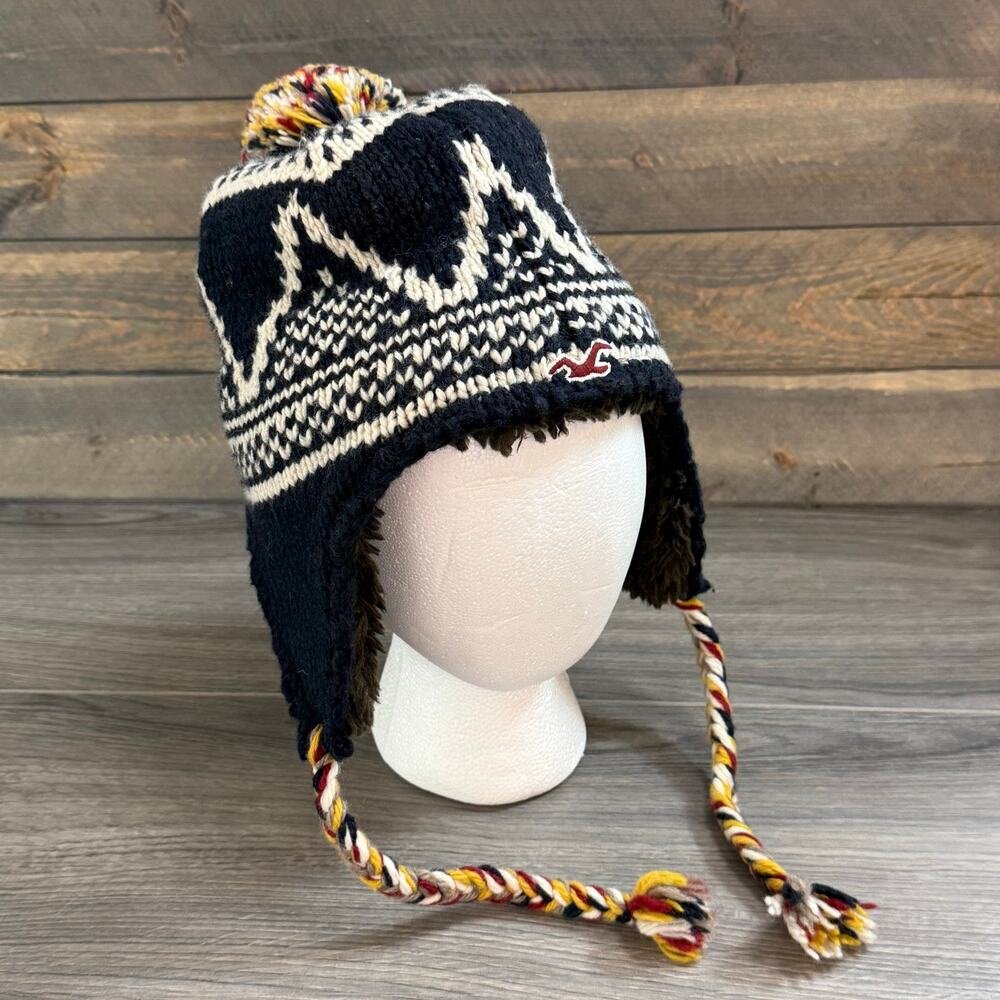 Hollister Wool Blend Ear Flap Knit Hat Fleece Lined Tasseled Nordic OS Logo